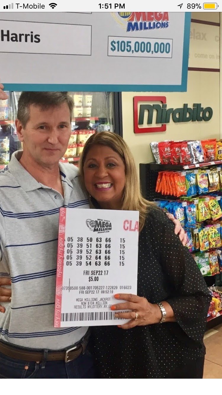 Lottery winners holding a Mega Millions ticket with five structured plays